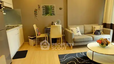 Cozy living room with modern decor and open kitchen layout