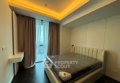 Modern bedroom with stylish lighting and large window view