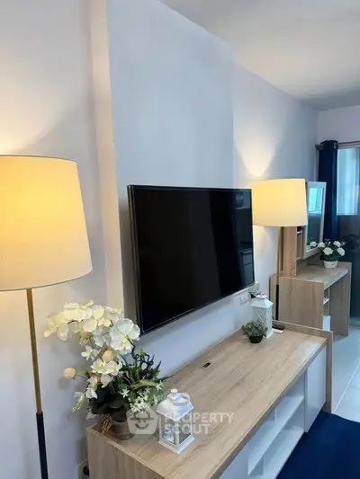 Modern living room with sleek TV setup and elegant decor