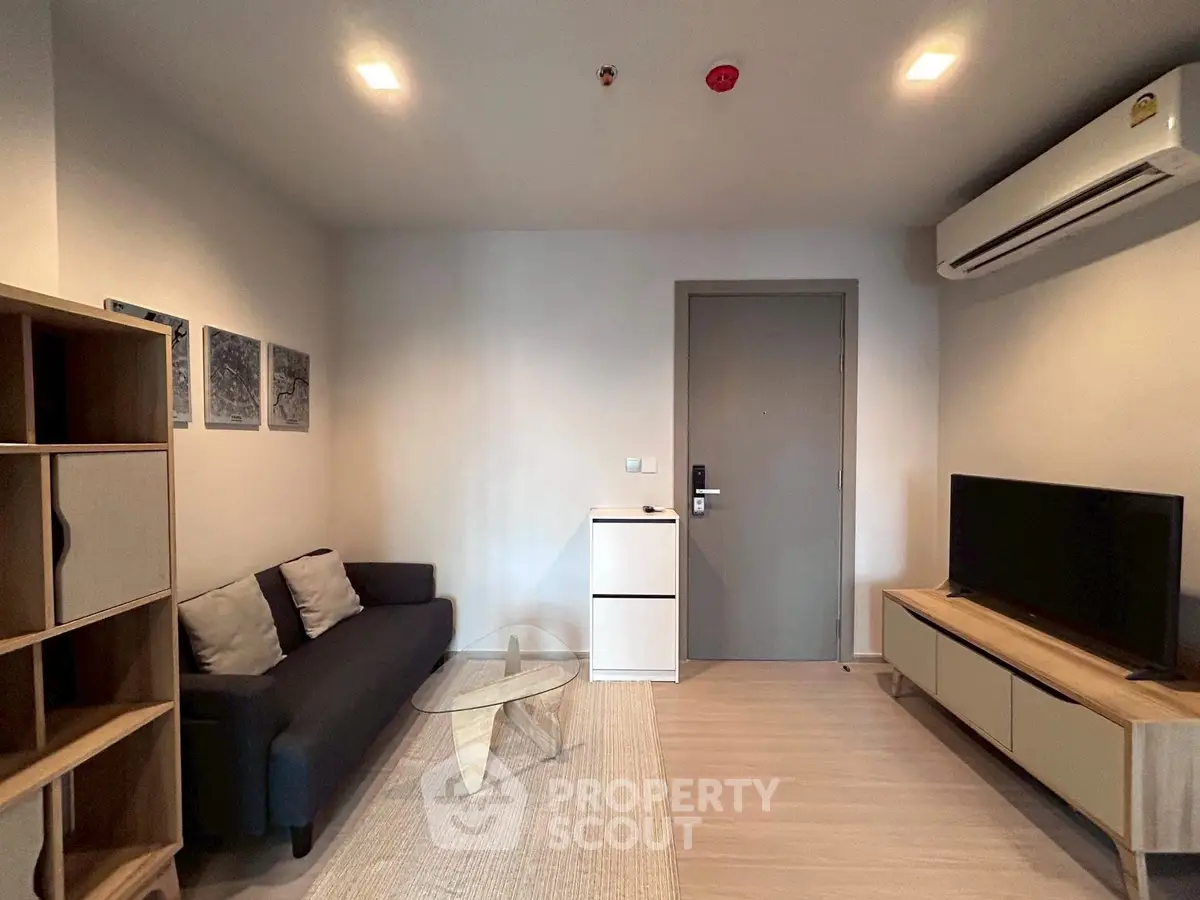 Modern living room with sleek furniture and air conditioning