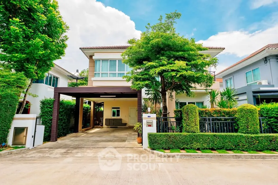 Charming suburban house with lush greenery and spacious driveway