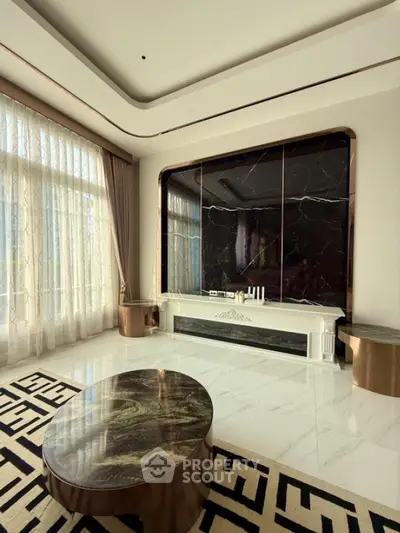 Luxurious living room with marble accents and large windows
