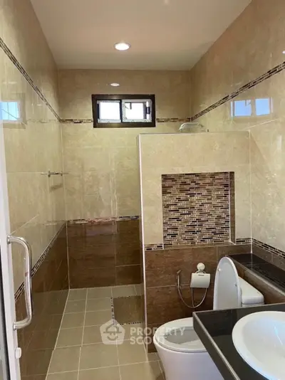 Modern bathroom with elegant tile design and sleek fixtures