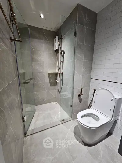 Modern bathroom with sleek shower and elegant tile design