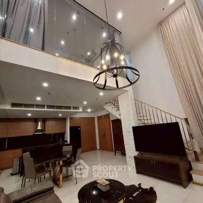 Luxurious modern living room with high ceiling and elegant chandelier