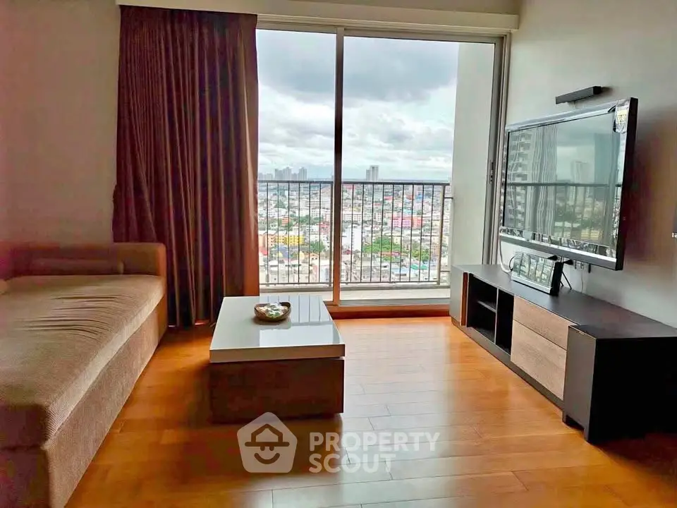 Spacious living room with city view, modern furnishings, and large window for natural light.