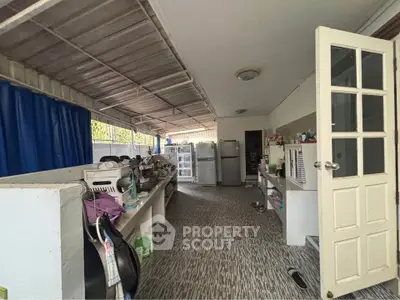 Spacious kitchen with open layout and modern appliances in a well-lit area.