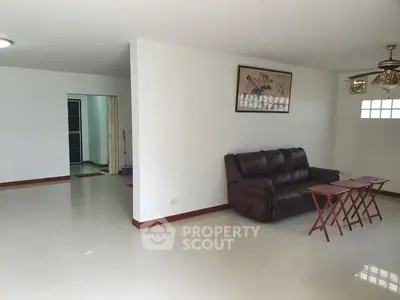 Spacious living room with leather sofa and modern decor