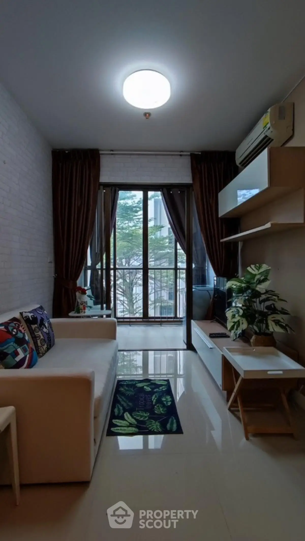 Modern living room with large windows and stylish decor