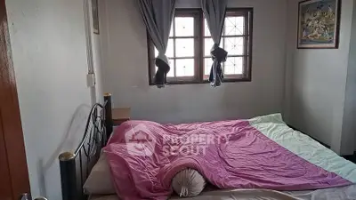 Cozy bedroom with natural light and stylish decor