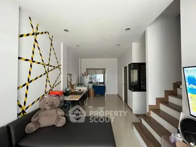 Modern living room with unique wall design and cozy seating area