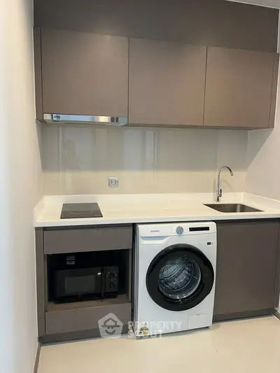 Modern kitchen with integrated appliances and sleek cabinetry