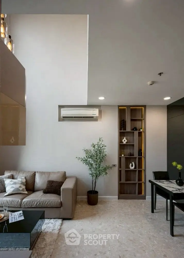 Modern living room with high ceiling and stylish decor