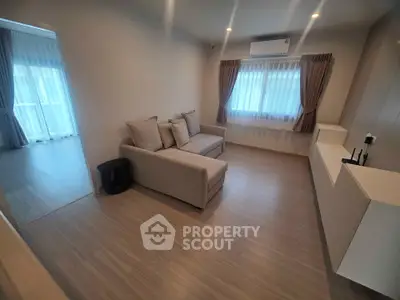 Modern living room with cozy sofa and stylish decor