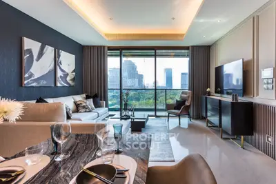 Luxurious living room with modern decor and stunning city view from large windows.