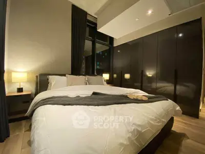 Luxurious modern bedroom with elegant lighting and large wardrobe