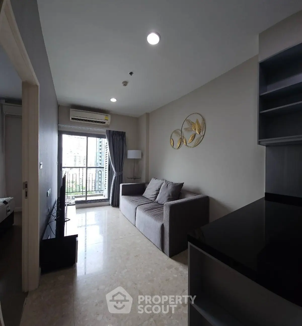 Modern living room with balcony access and stylish decor