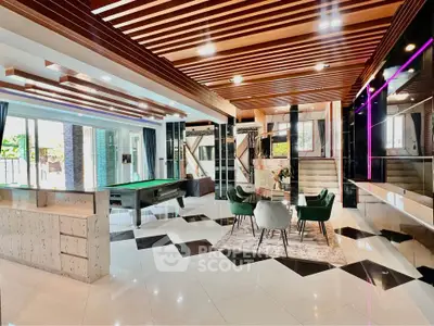 Luxurious modern living room with stylish decor and pool table