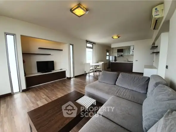 Spacious modern living room with open kitchen and stylish furniture