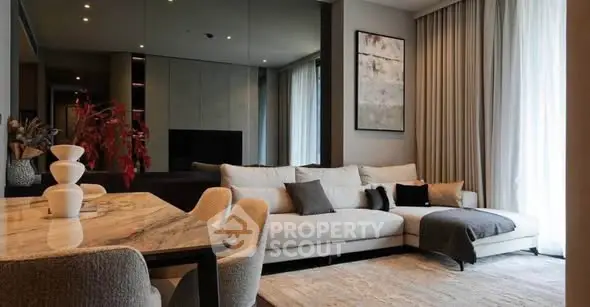 Luxurious modern living room with elegant decor and large sectional sofa.