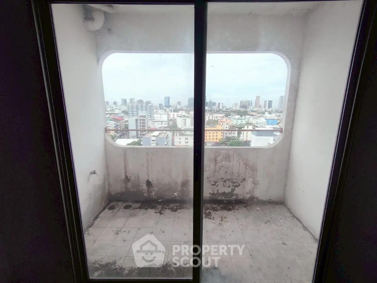 Urban balcony with panoramic city view, ideal for high-rise living enthusiasts.