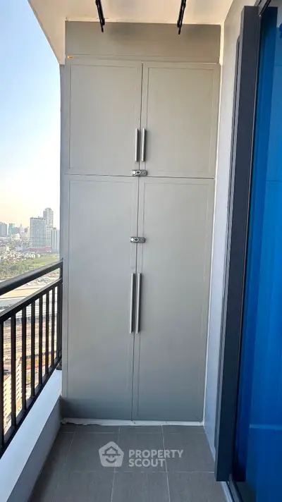 Modern balcony with city view and sleek storage cabinet