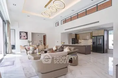 Luxurious open-plan living room with modern kitchen and elegant decor