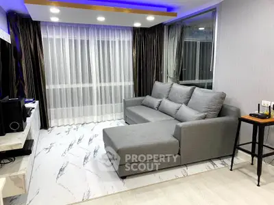 Modern living room with stylish gray sectional sofa and elegant marble flooring