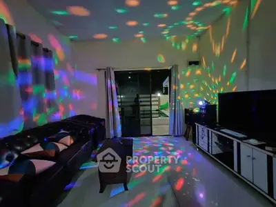 Vibrant living room with colorful disco lights and modern furniture