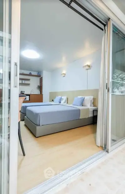 Modern bedroom with sliding glass doors and stylish decor