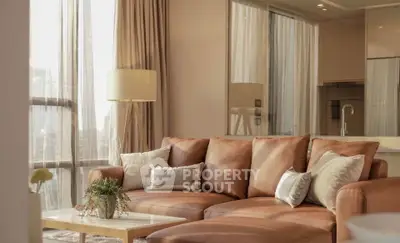 Luxurious living room with elegant leather sofa and floor-to-ceiling windows offering stunning city views.