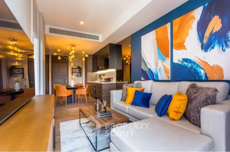 Modern living room with vibrant decor and open kitchen layout