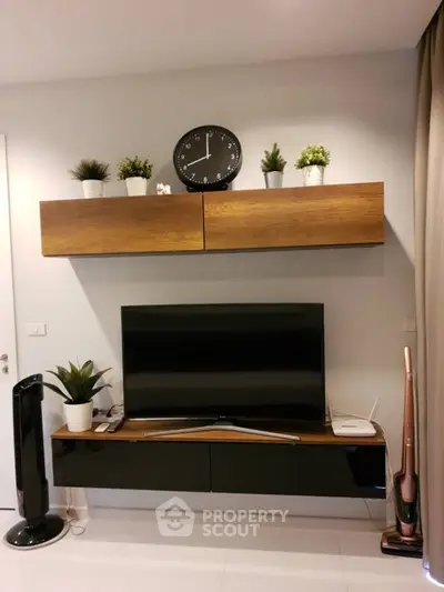 Modern living room with sleek TV setup and stylish decor