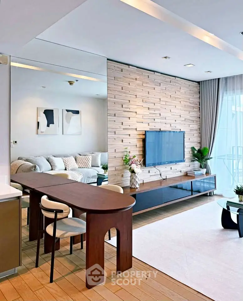Modern living room with stylish decor, wooden accents, and natural light.