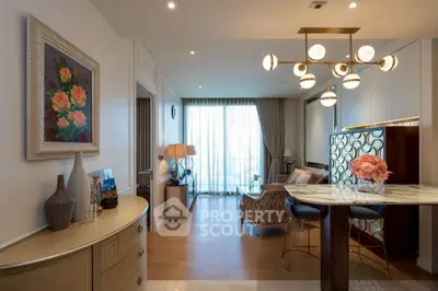 Elegant living room with modern decor and stylish lighting, featuring a cozy seating area and a chic marble table.