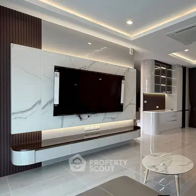 Modern living room with sleek marble TV wall and stylish furniture
