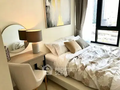 Cozy modern bedroom with stylish decor and city view, perfect for urban living.