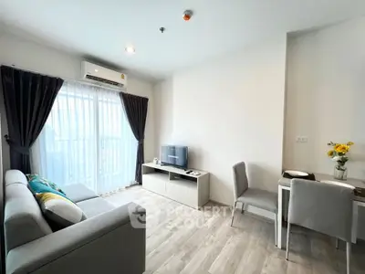 Modern living room with sleek furniture and natural light, perfect for urban living.