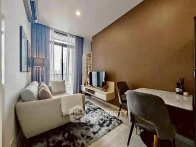 Modern living room with cozy decor and city view from large window