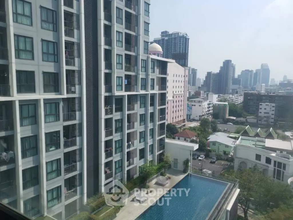 Stunning cityscape view from high-rise apartment with pool and skyline