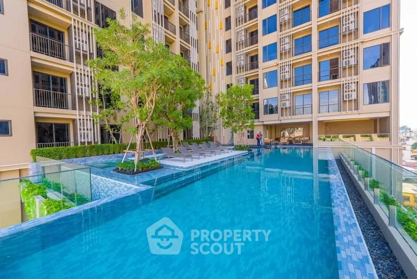 Luxurious apartment complex with stunning rooftop pool and modern design.