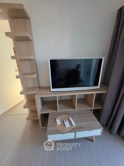 Modern living room with stylish TV stand and shelving unit