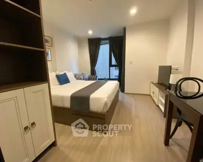 Modern bedroom with stylish decor and natural light