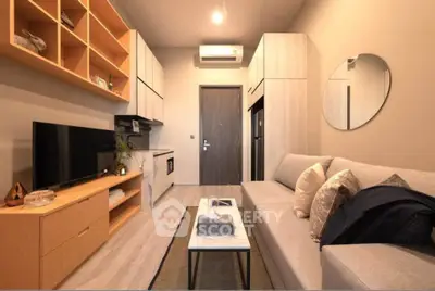 Modern living room with sleek furniture and built-in storage, featuring a cozy sofa and stylish decor.