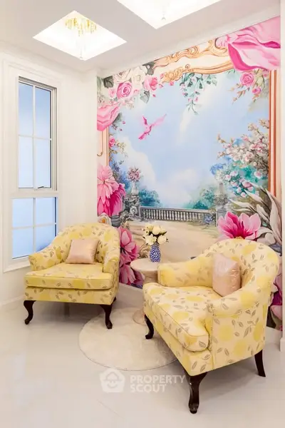 Elegant living room with floral mural and yellow armchairs, perfect for a cozy and stylish home.