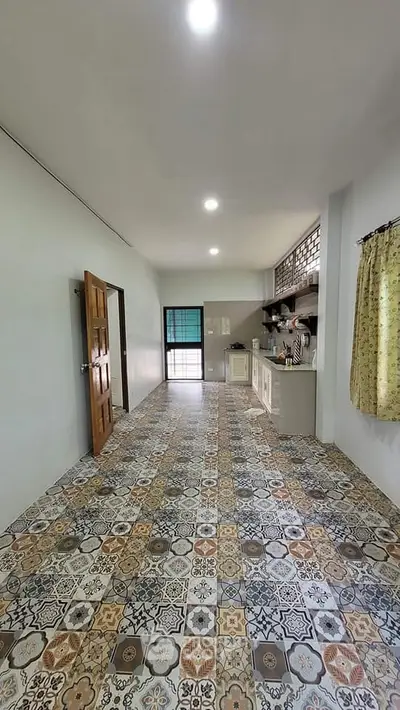 Spacious kitchen with unique patterned tile flooring and open layout