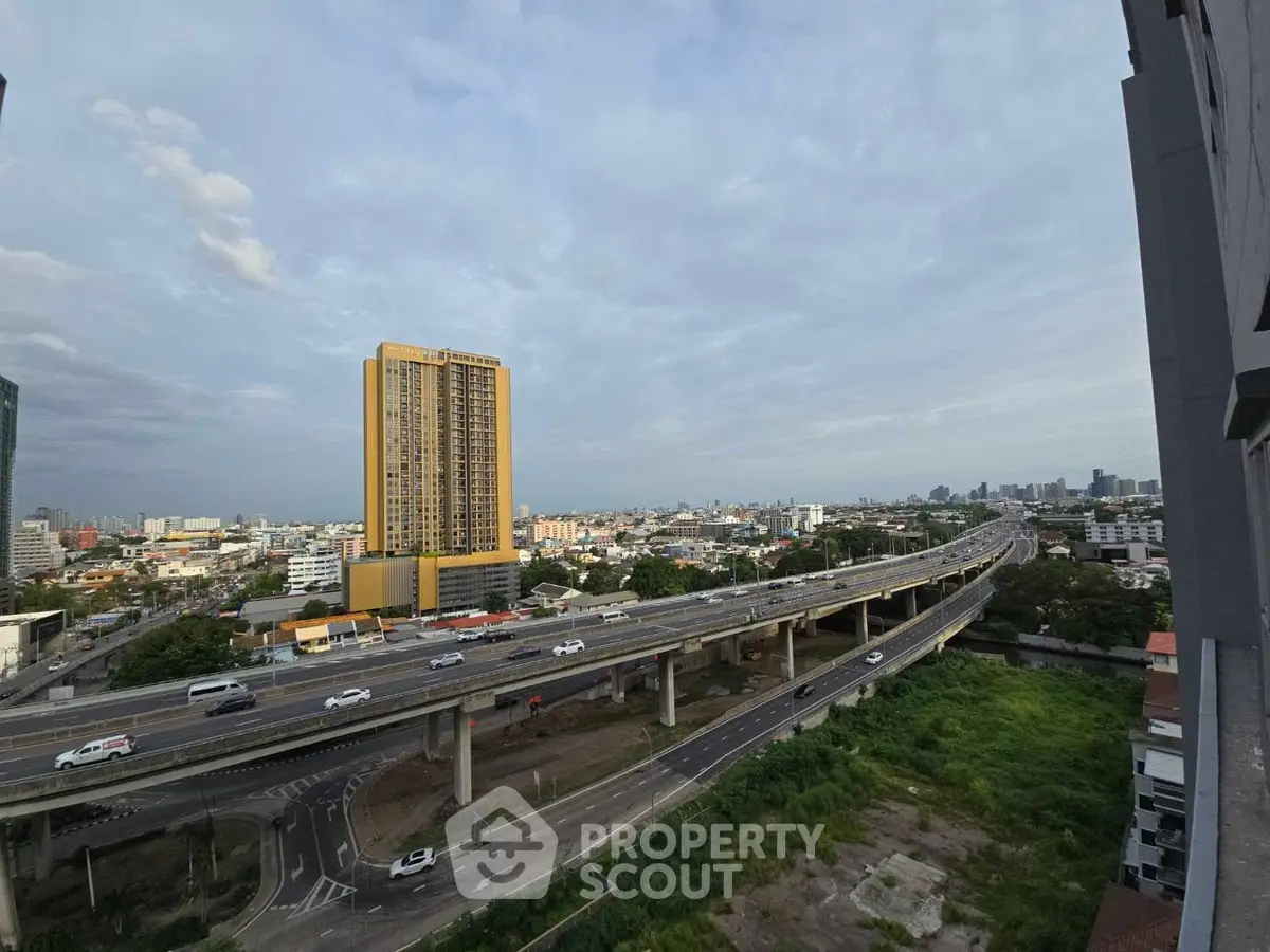 Stunning cityscape view with highway and high-rise building, perfect for urban living enthusiasts.