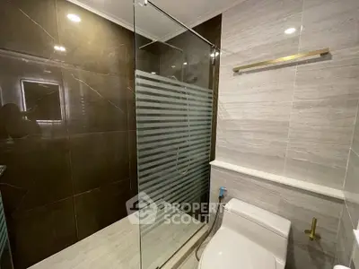 Modern bathroom with glass shower and sleek design