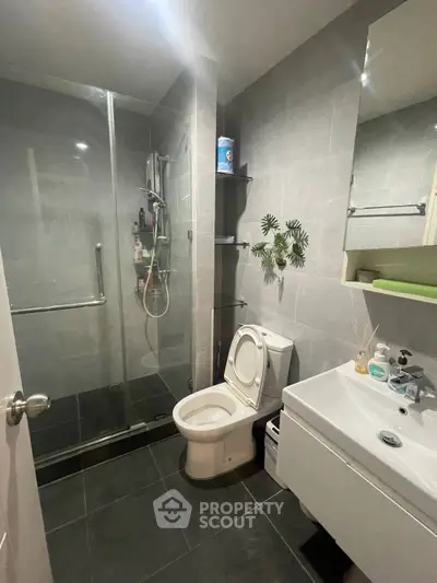 Modern bathroom with glass shower and sleek fixtures