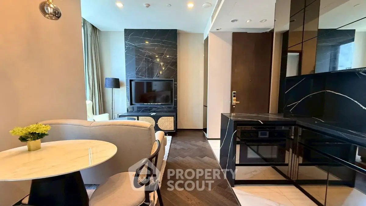 Luxurious modern living room with sleek black marble accents and cozy seating area.